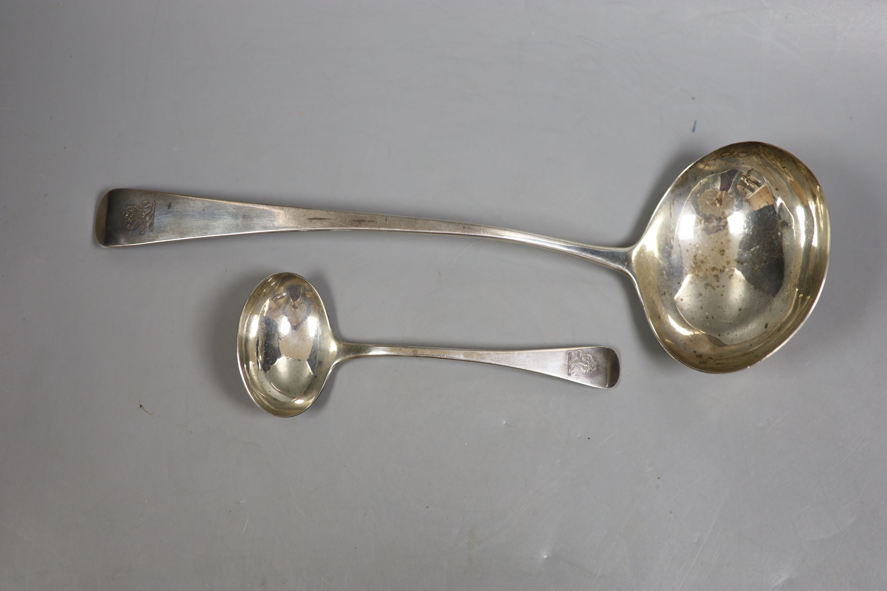 A George III silver Old English pattern soup ladle, London, 1804, 31.1cm and a similar George IV sauce ladle, London, 1824, 196 grams.